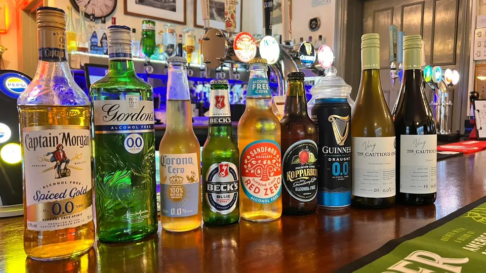 A line-up of drinks including alcohol-free options on the bar